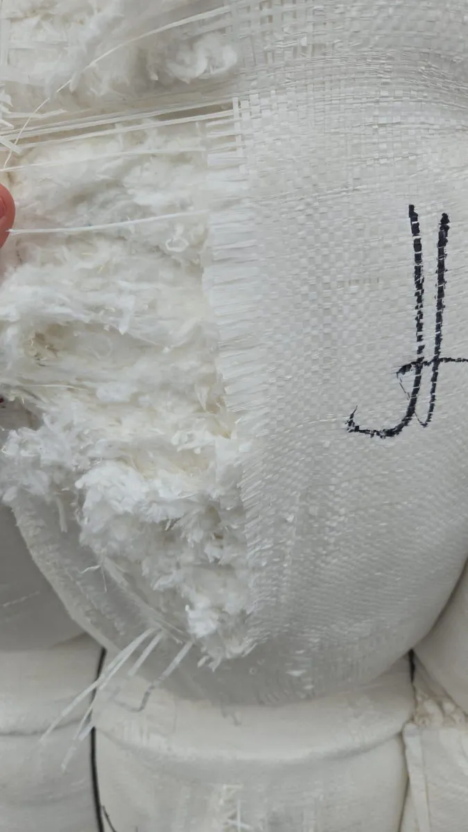 Opened hydrophilic cotton bale showing the bright white fiber