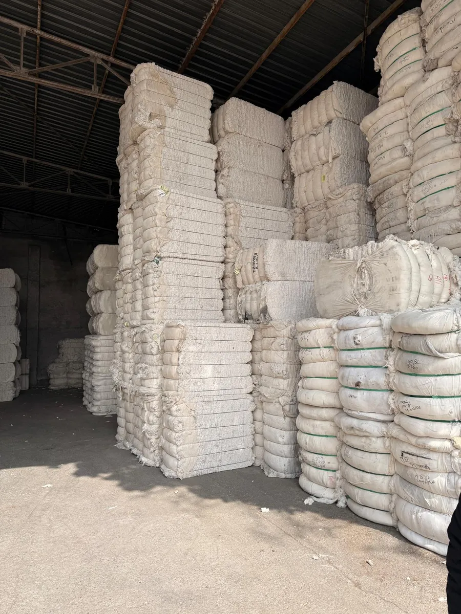 Round and pressed waste bales stacked high