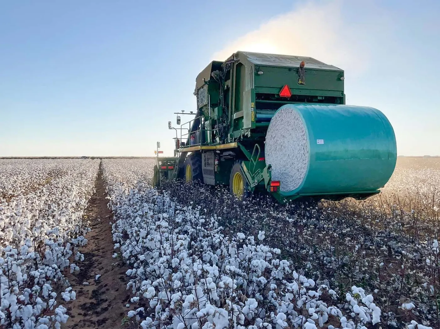 Cotton picker ejecting a wrapped module