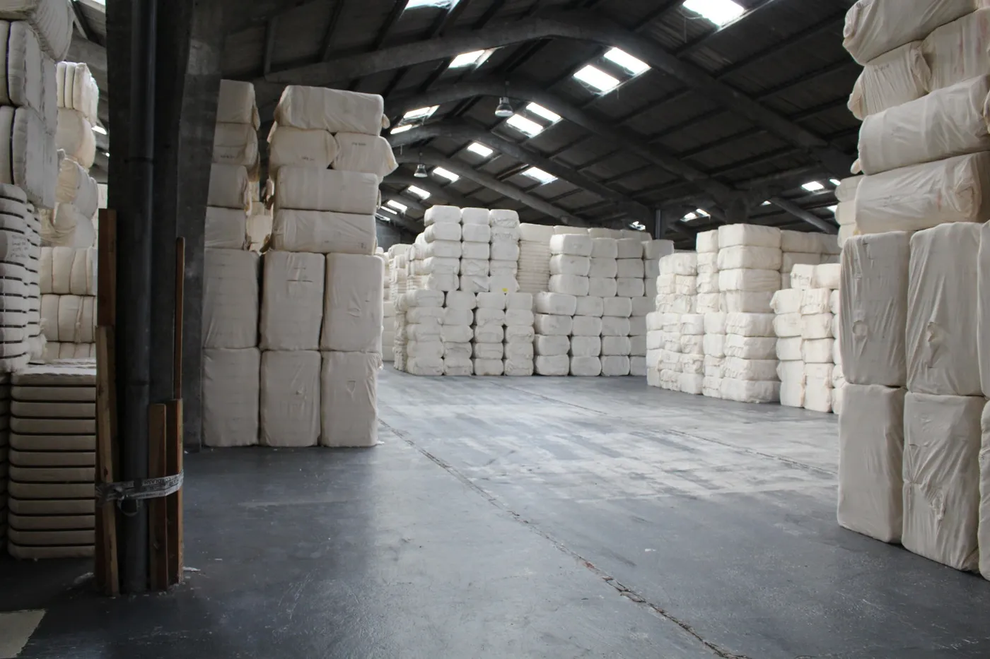 Warehouse aisle of wrapped bales
