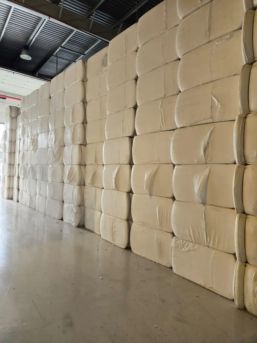 Hydrophilic cotton bales stacked to the ceiling